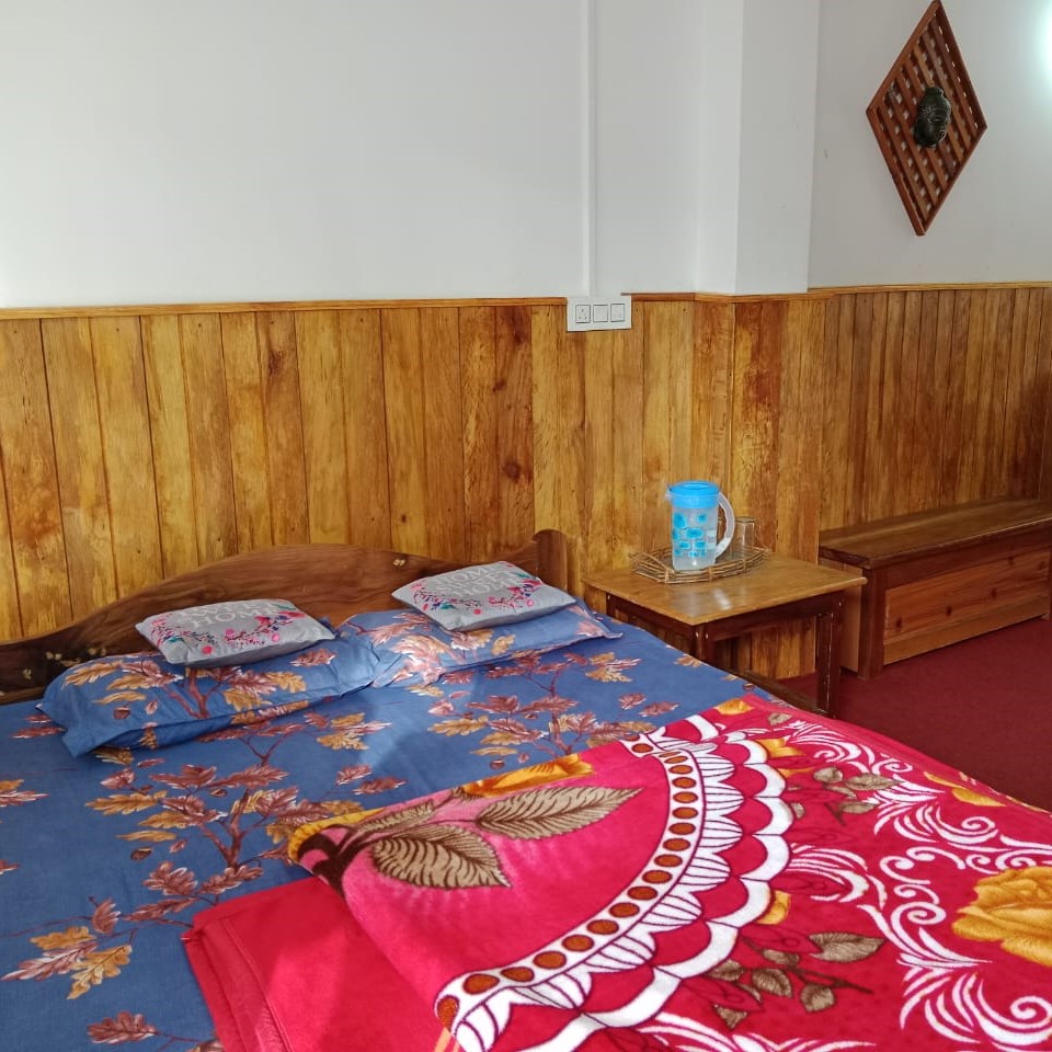 Family homestay in Kolakham with cozy rooms, mountain views, and a peaceful environment for all ages